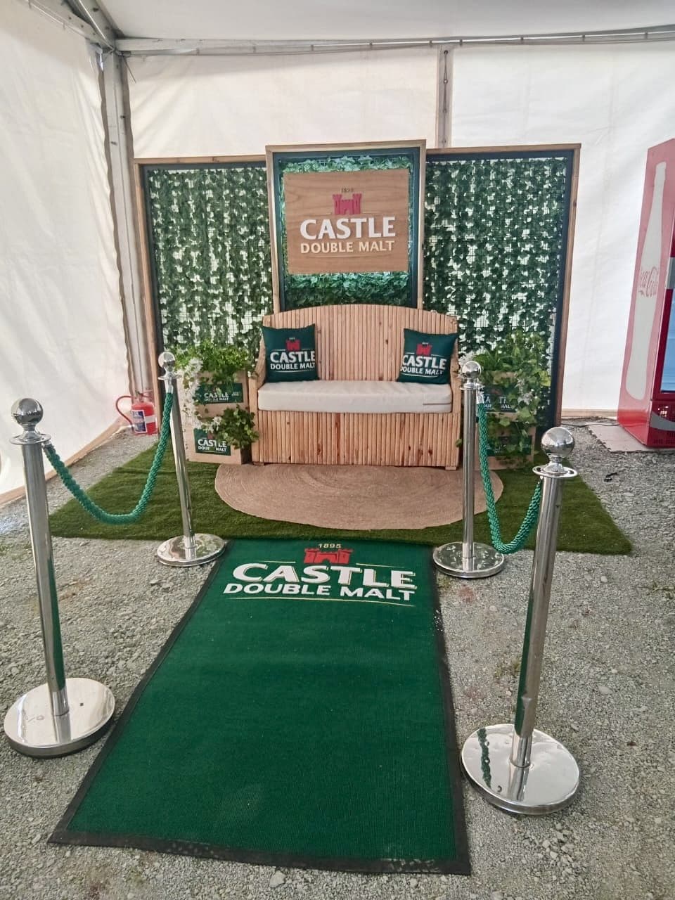 Castle Double Malt branded throne photo activation with green carpet and stanchions
