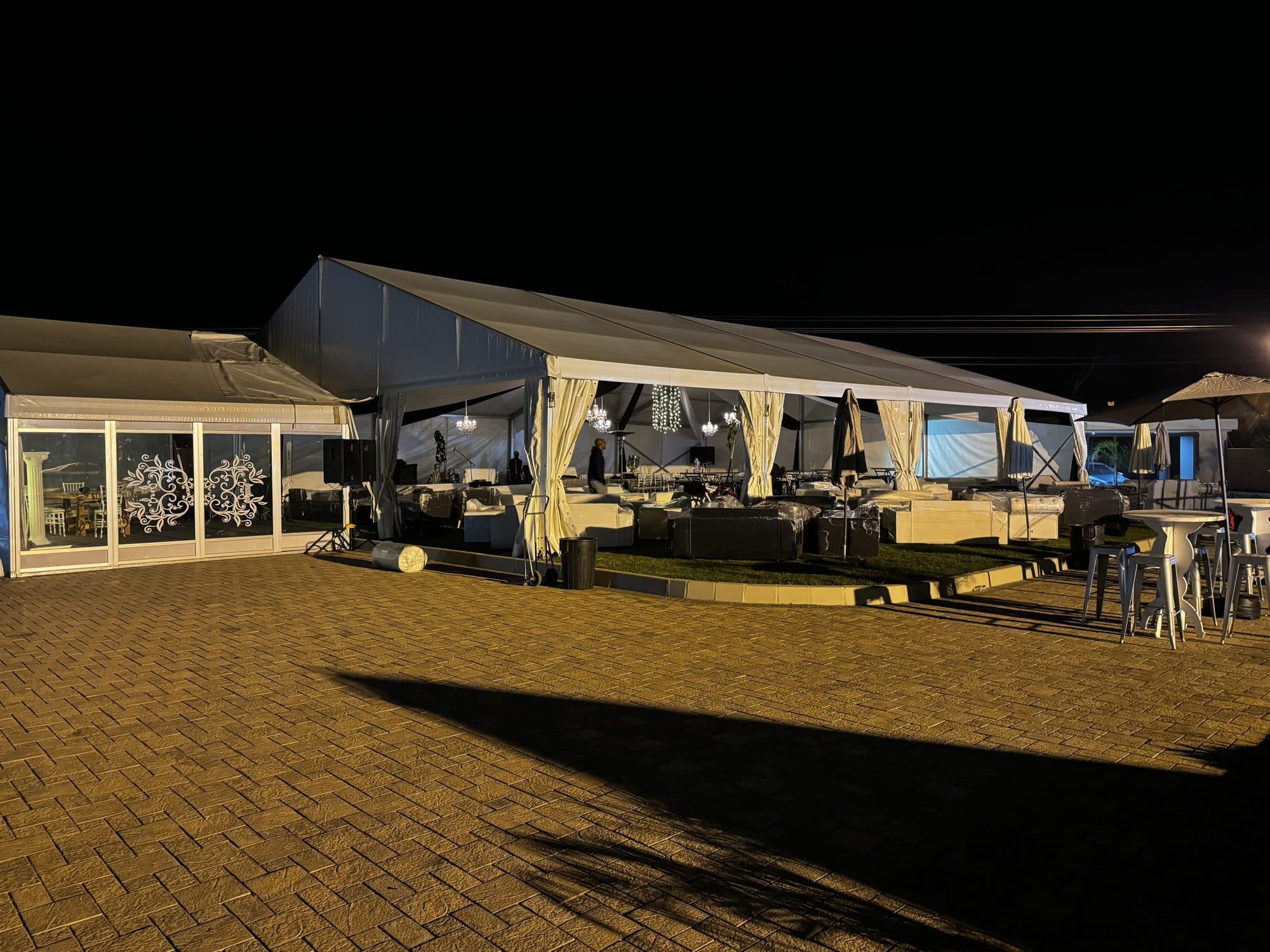 Marquee lounge setup glowing at night